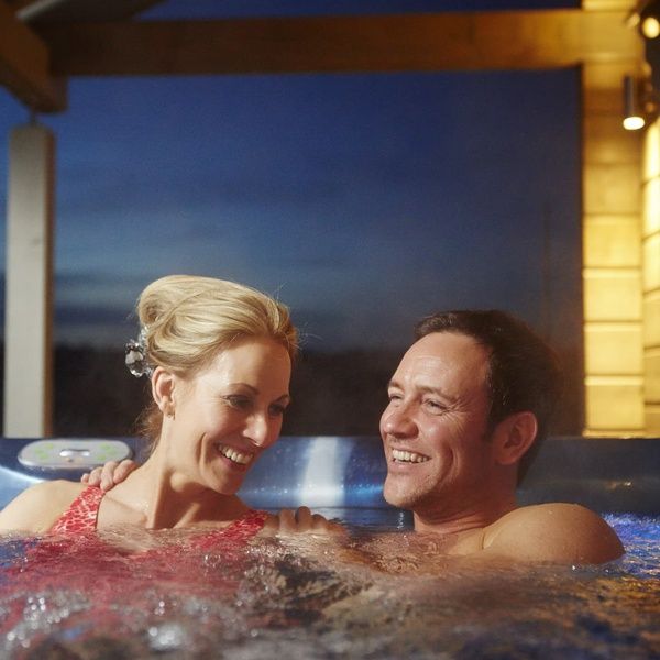 Hunter Lodges Hot Tub Couple