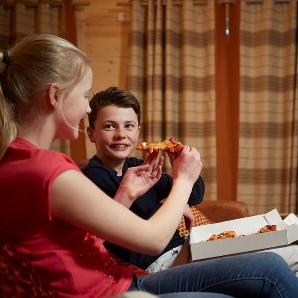Children eating pizza in Hunter Lodge