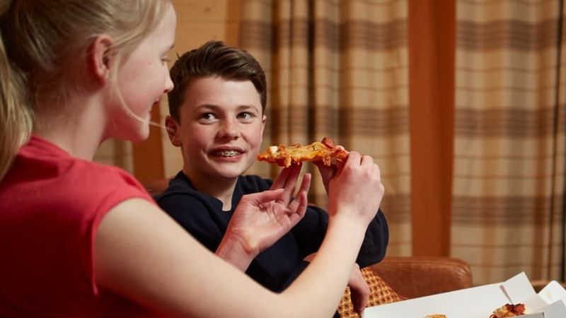 Children eating pizza in Hunter Lodge